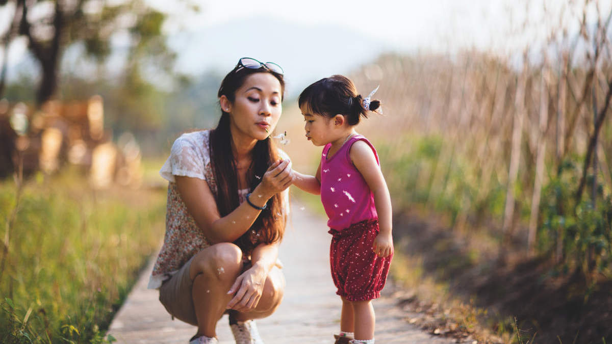 The gift of life, QFT, Quantiferon, asian mother with daughter, offer flower to mum, immune response